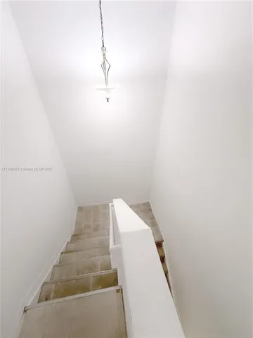 a view of a room with white walls