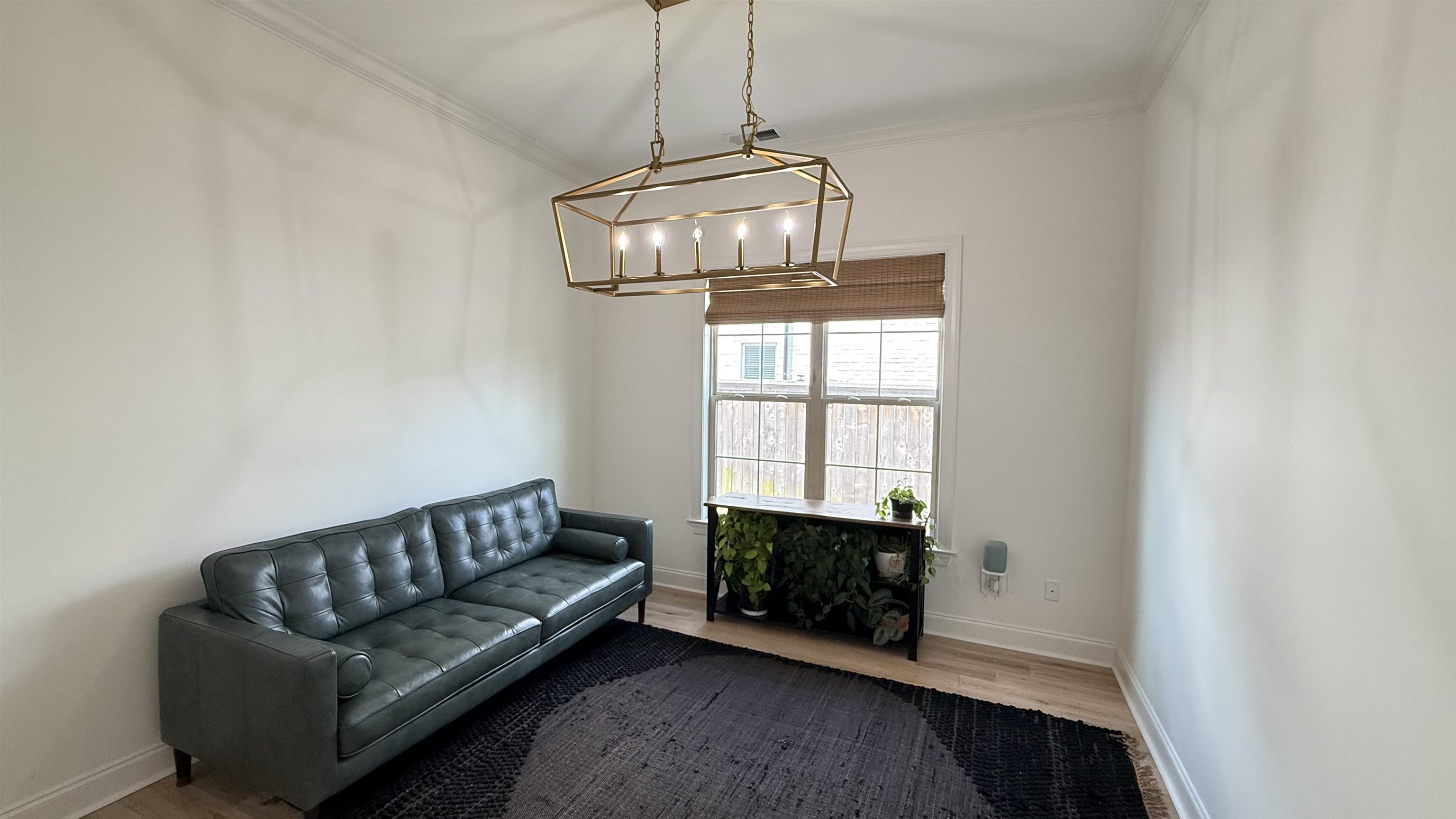 1746 Chadwick Farms Loop North Collierville, TN 38017 - Photo 10 of 35 Living area with a chandelier, ornamental molding, and wood finished floors