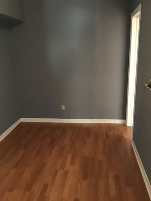 4163 Swann Street Columbus, GA 31903 - Photo 2 of 3 a view of an empty room with wooden floor