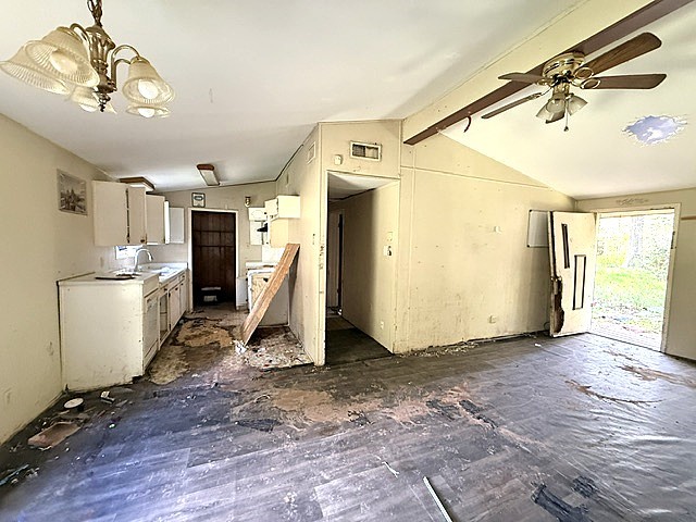 58 Roy Webb Road Huntsville, TX 77320 - Photo 3 of 31 Kitchen and breakfast area with living room in the brick home.