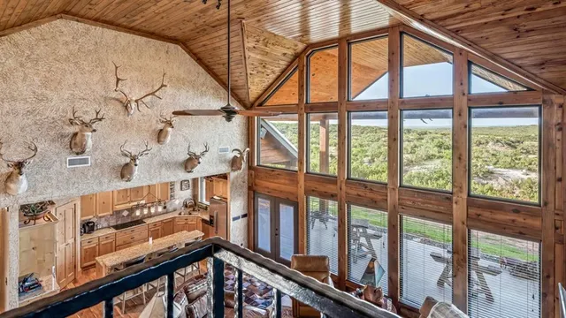 a large kitchen with stainless steel appliances granite countertop a sink and cabinets