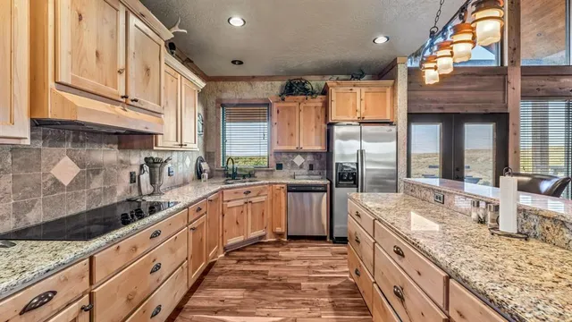 a outdoor living space with patio furniture and a fireplace