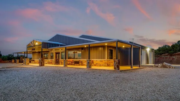 a view of a house with basketball court