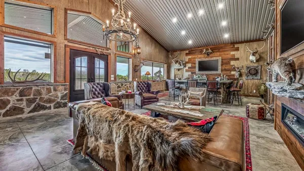a living room with lots of furniture and a flat screen tv