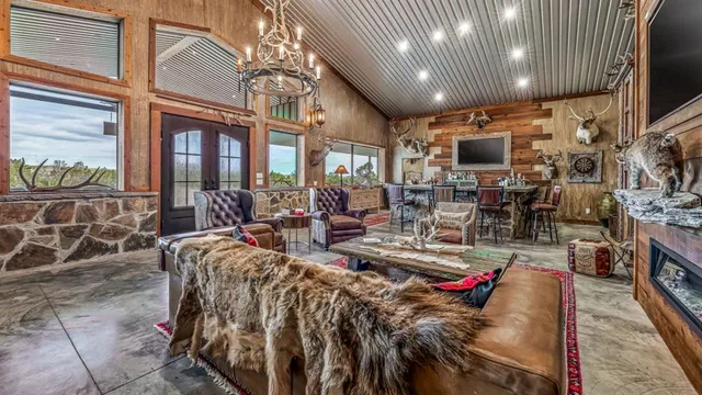 a living room with lots of furniture and a flat screen tv