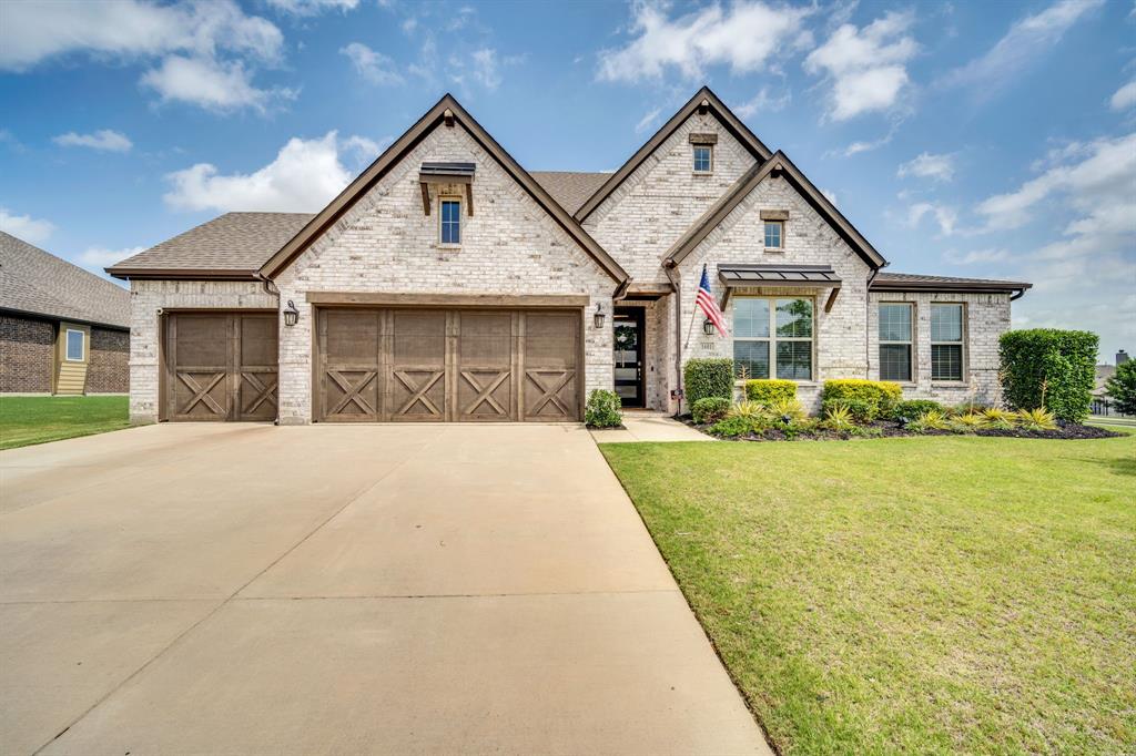 1601 Bear Path Way Gunter, TX 75058 - Photo 38 of 40 a front view of a house with a yard and potted plants