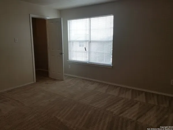 a white toilet sitting next to a bathtub