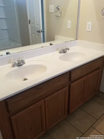 a view of a house with a door and wooden floor