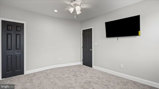 a bathroom with a sink a mirror and a toilet