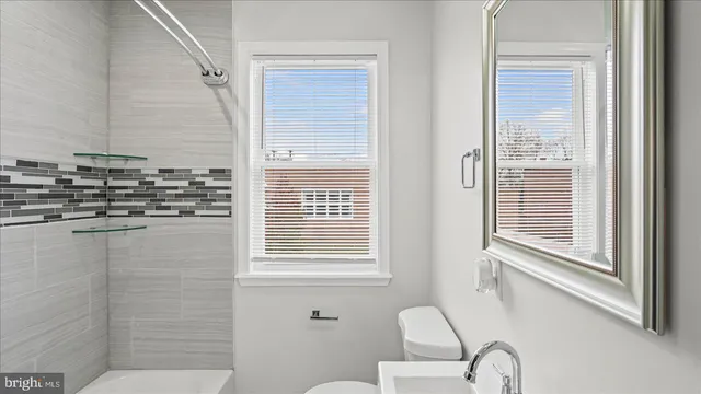 a view of a hallway with a living room