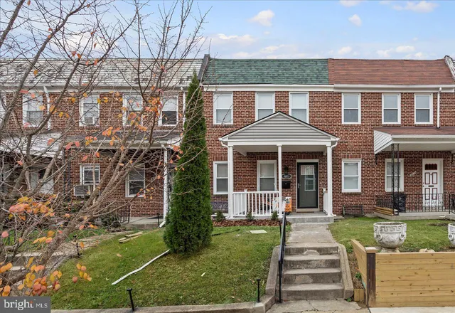 front view of a house with a yard