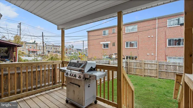 a view of a brick house with a large window