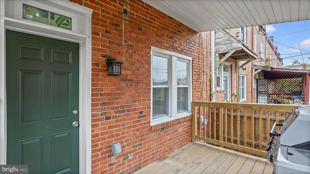 a view of a house with wooden fence