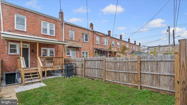 a view of a house next to a yard