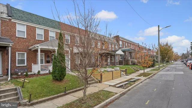 a picture of a bench in front of a wall