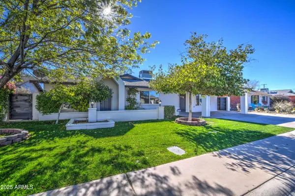 front view of a house with a yard