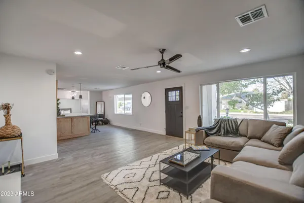 a living room with furniture and a large window