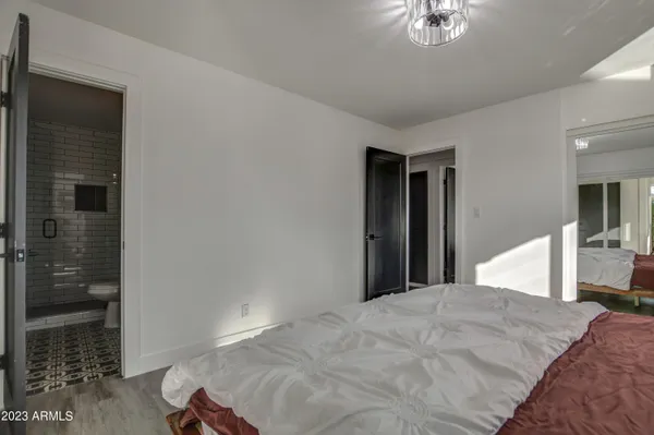 a bedroom with two beds and a window