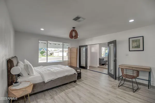 a bedroom with a bed and cabinets