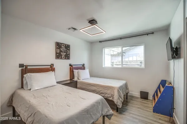 a view of a backyard with potted plants