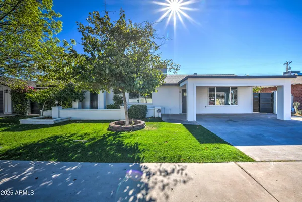 front view of a house with a yard