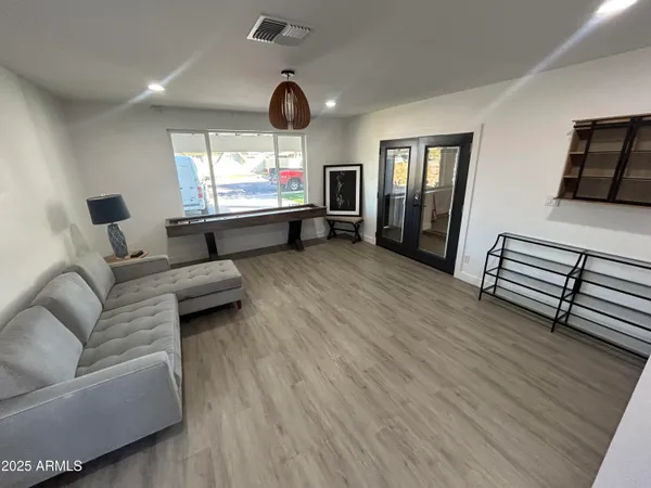 a living room with furniture and a large window