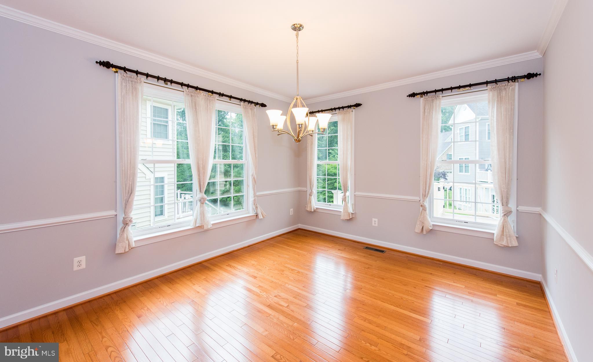 8043 High Castle Road Ellicott City, MD 21043 - Photo 5 of 28 Dining Room w/ room full of windows