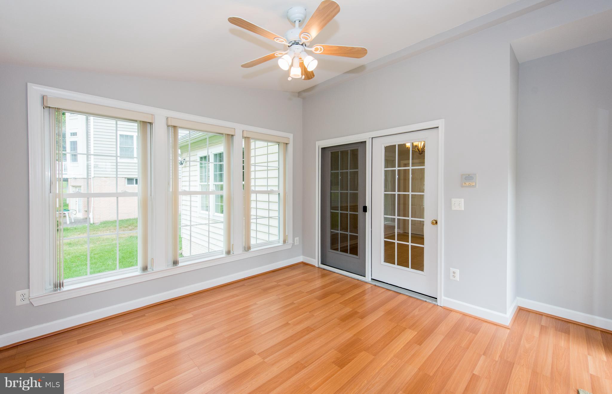8043 High Castle Road Ellicott City, MD 21043 - Photo 10 of 28 Bright Sun Room leading off Breakfast Area