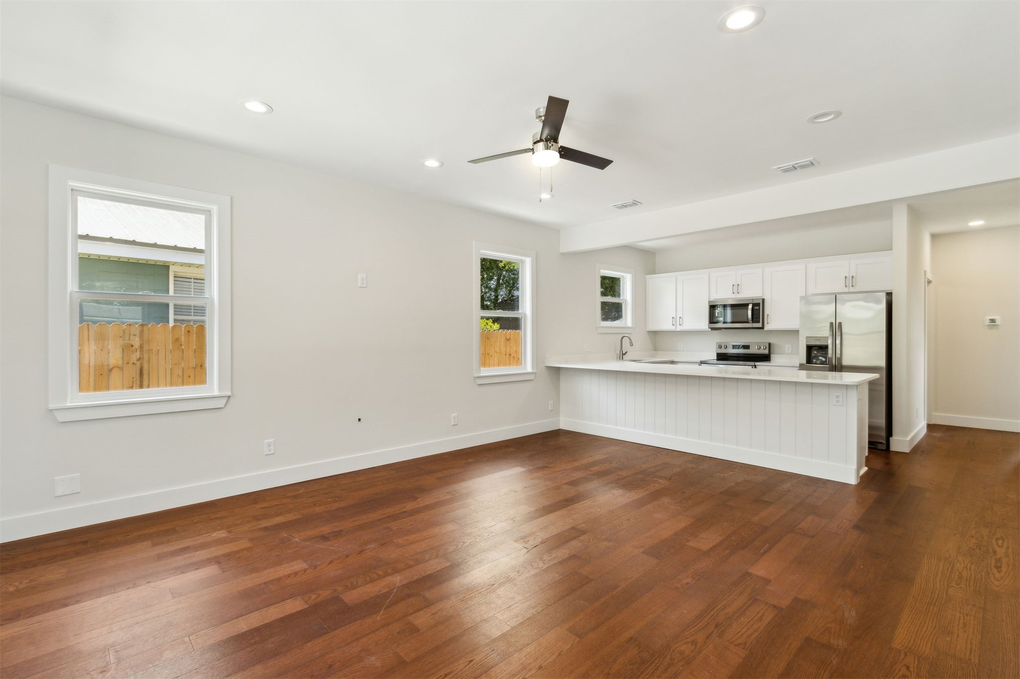 929 South 9th Street Fernandina Beach, FL 32034 - Photo 11 of 36 a view of kitchen with granite countertop cabinets and wooden floor