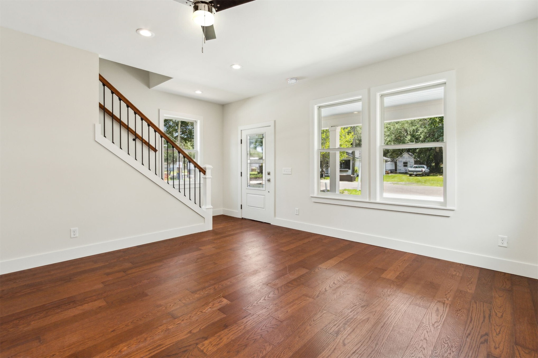 929 South 9th Street Fernandina Beach, FL 32034 - Photo 13 of 36 a view of an entryway with wooden floor windows and a ceiling fan