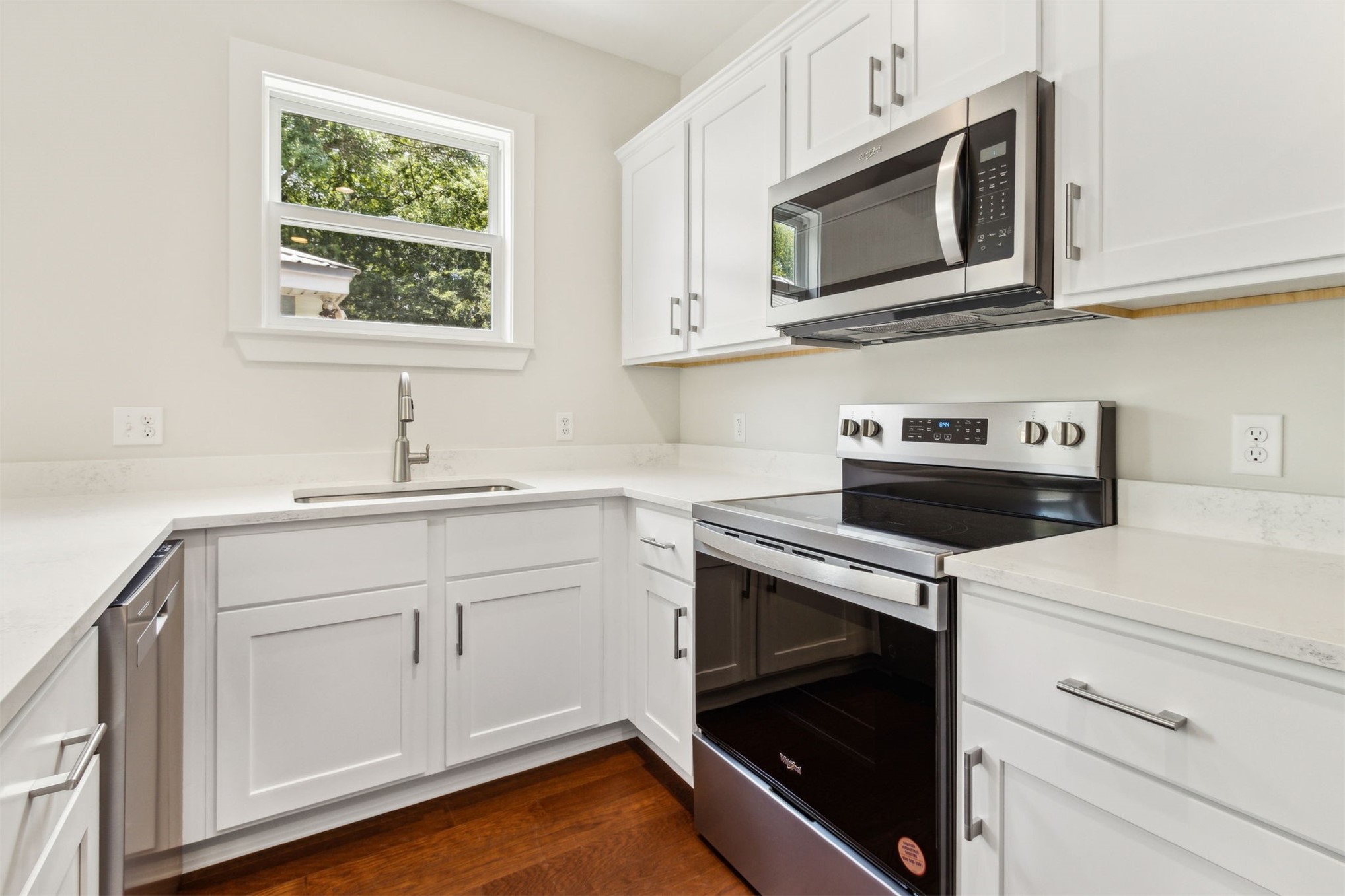 929 South 9th Street Fernandina Beach, FL 32034 - Photo 17 of 36 a kitchen with a sink stove and microwave