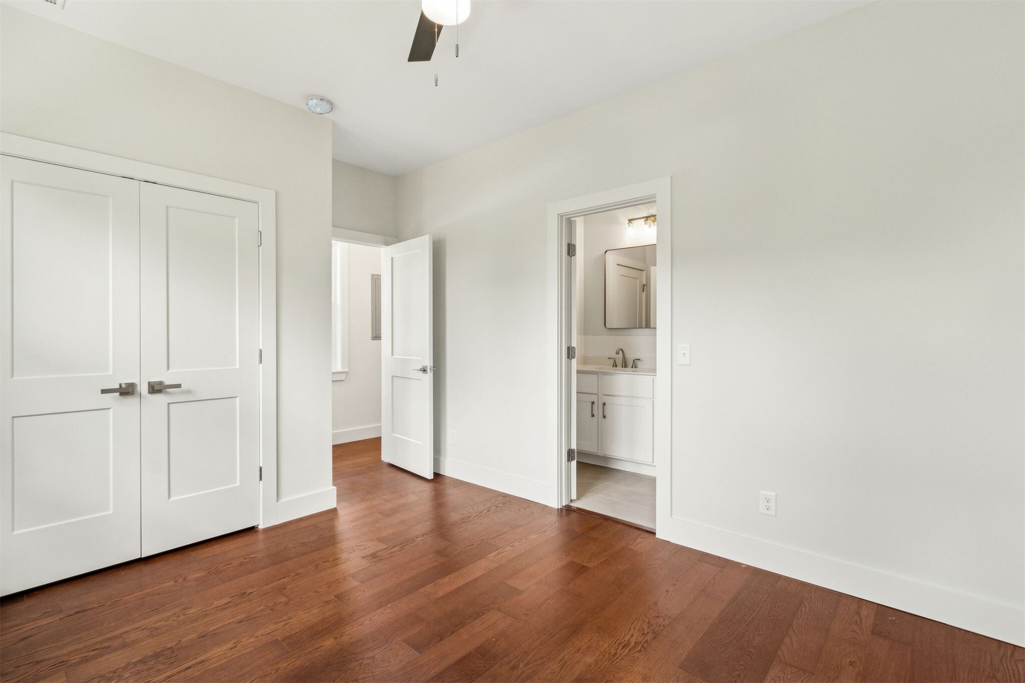 929 South 9th Street Fernandina Beach, FL 32034 - Photo 22 of 36 an empty room with wooden floor and windows