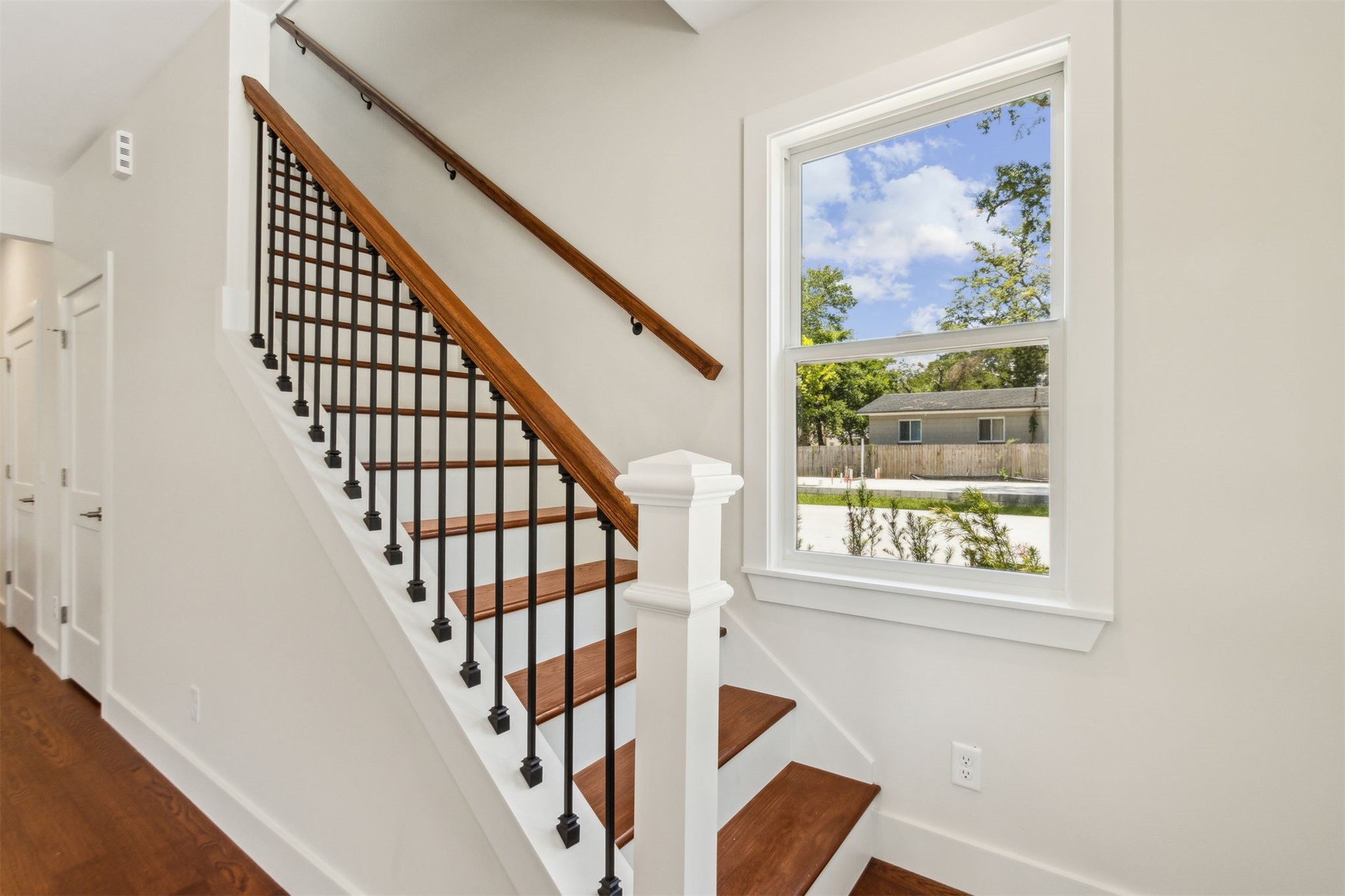 929 South 9th Street Fernandina Beach, FL 32034 - Photo 24 of 36 a view of staircase with wooden floor and a window
