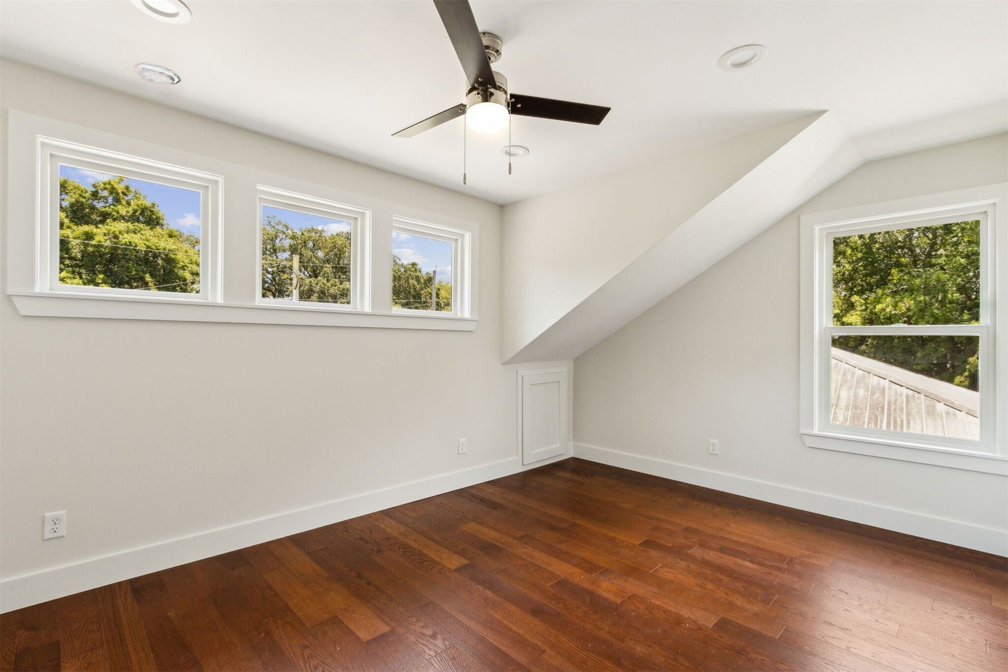 929 South 9th Street Fernandina Beach, FL 32034 - Photo 27 of 36 wooden floor in an empty room with a window