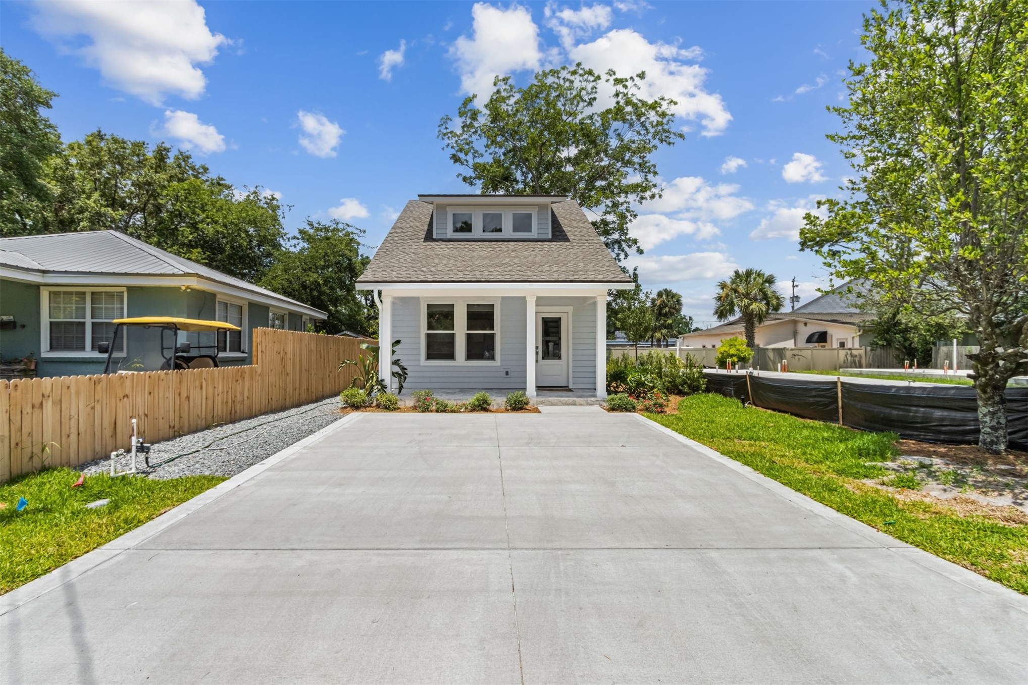929 South 9th Street Fernandina Beach, FL 32034 - Photo 3 of 36 a front view of a house with a yard and garage