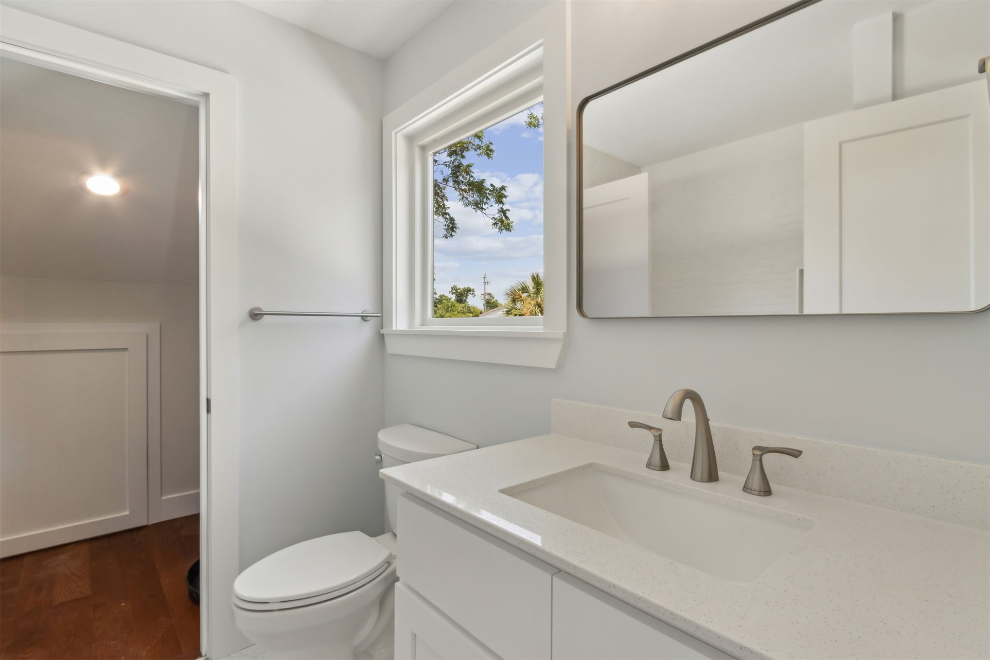 929 South 9th Street Fernandina Beach, FL 32034 - Photo 32 of 36 a bathroom with a toilet a sink and mirror