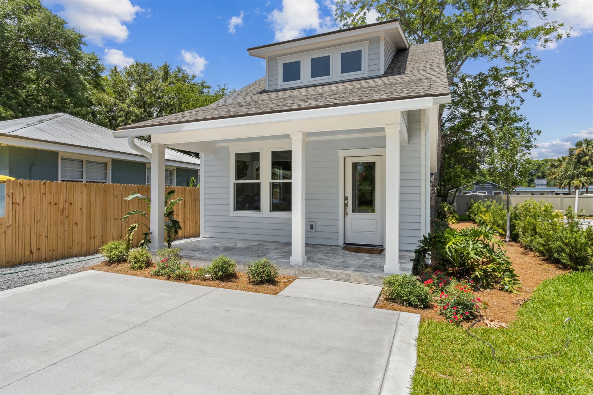 929 South 9th Street Fernandina Beach, FL 32034 - Photo 4 of 36 a front view of a house with a yard and garage