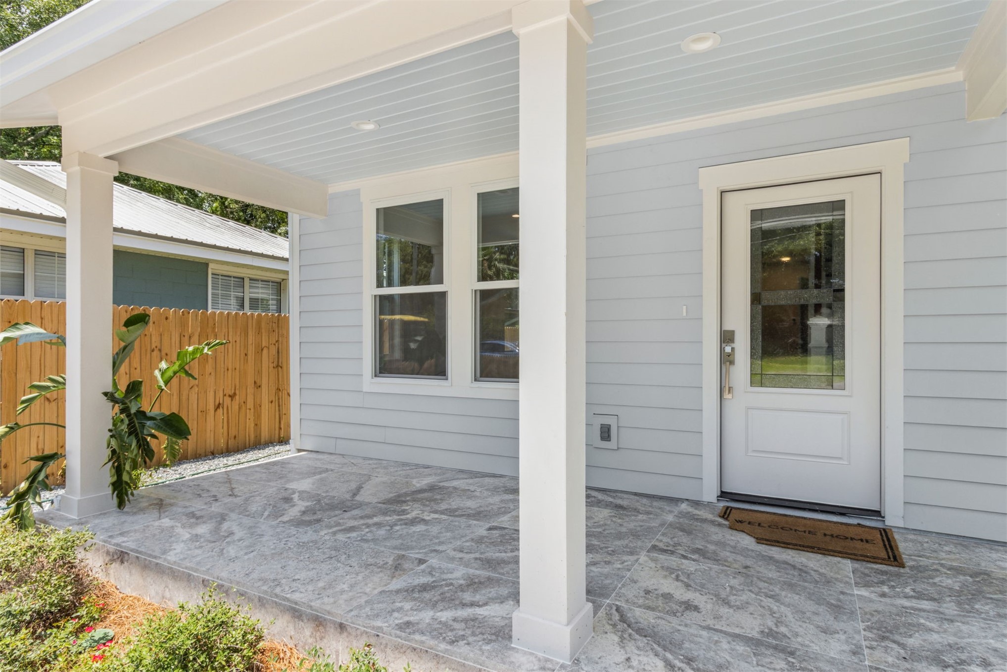 929 South 9th Street Fernandina Beach, FL 32034 - Photo 5 of 36 front view of a brick house with a large door