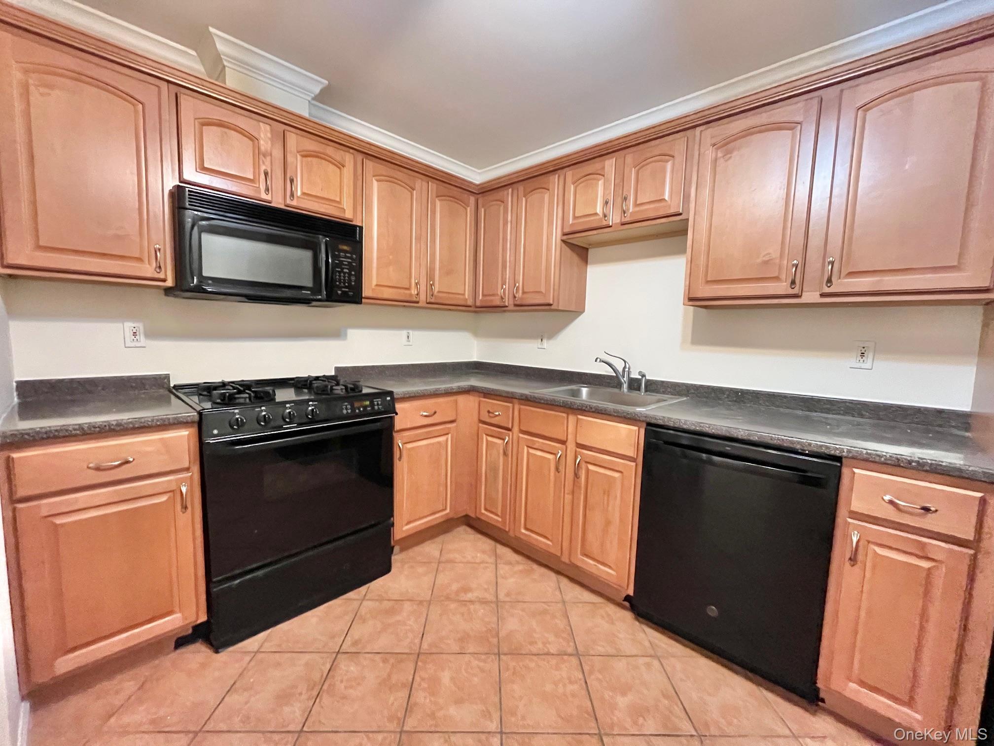 153 Montgomery Avenue, Unit B Scarsdale, NY 10583 - Photo 1 of 14 a kitchen with granite countertop cabinets stainless steel appliances and a sink