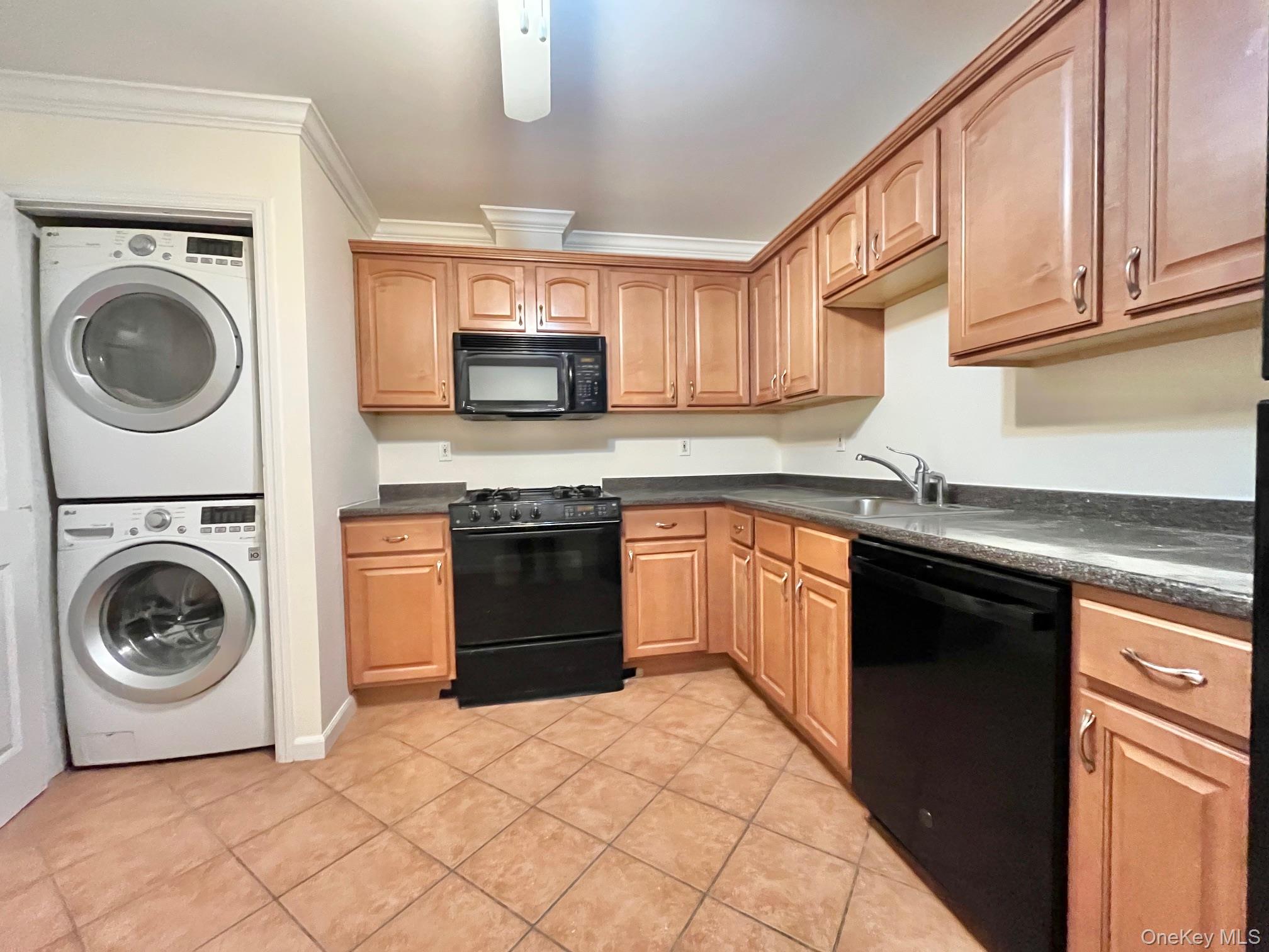 153 Montgomery Avenue, Unit B Scarsdale, NY 10583 - Photo 2 of 14 a kitchen with stainless steel appliances granite countertop a sink and cabinets