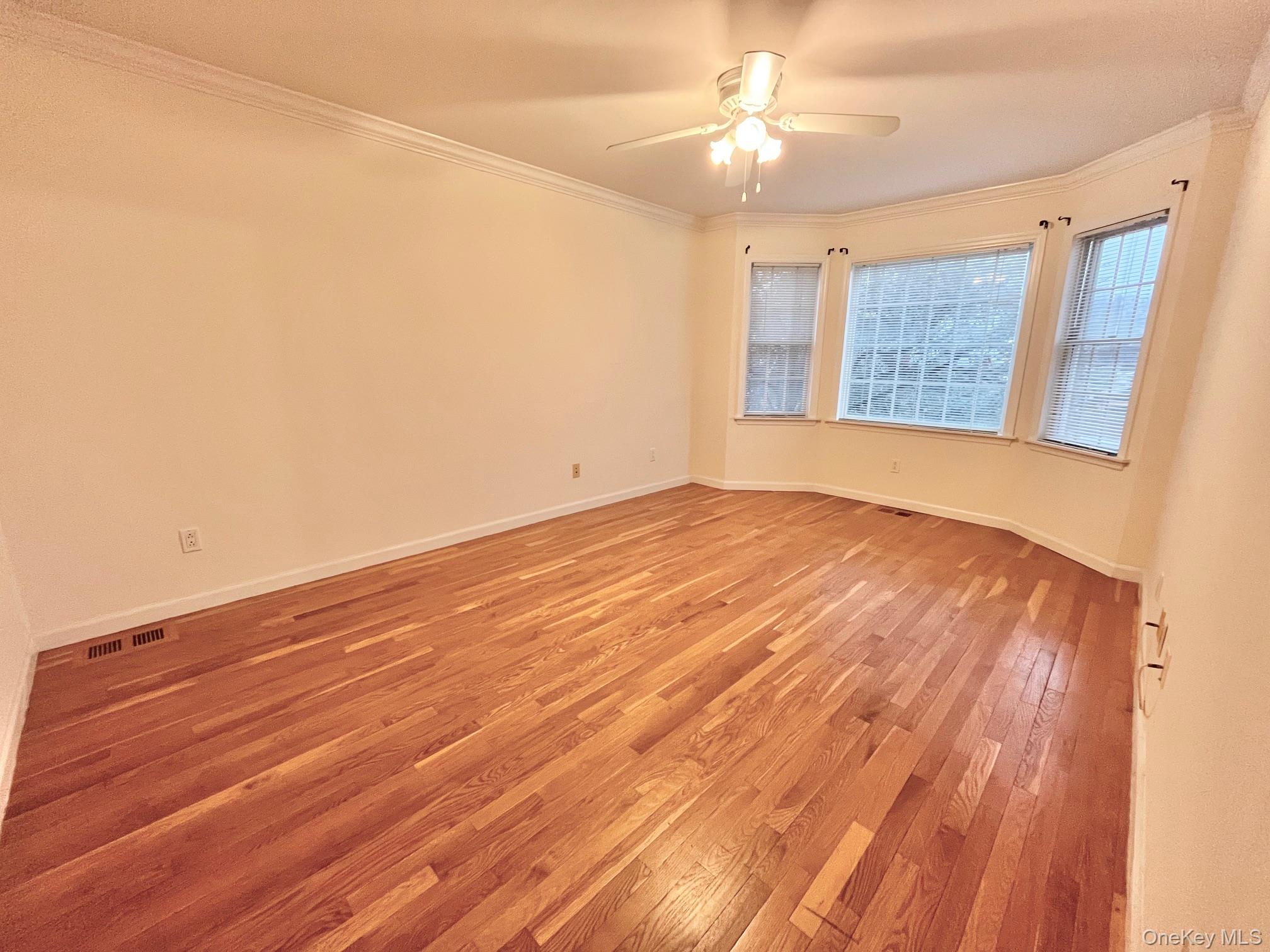 153 Montgomery Avenue, Unit B Scarsdale, NY 10583 - Photo 5 of 14 wooden floor in an empty room with a window