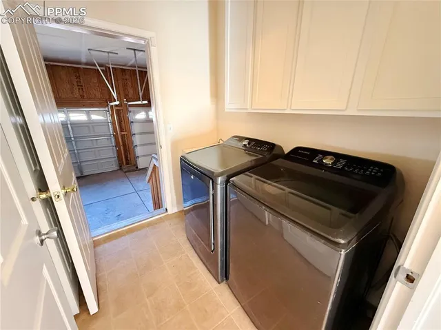 a view of a room with wooden floor and windows