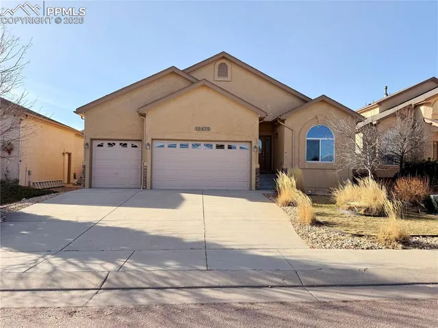 a front view of a house with garage
