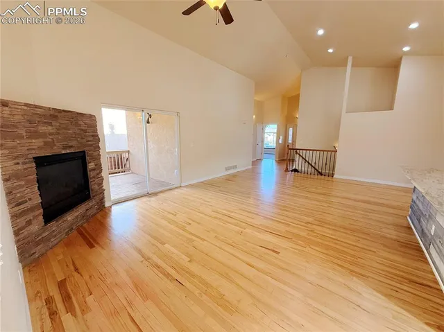 a view of a balcony with wooden floor
