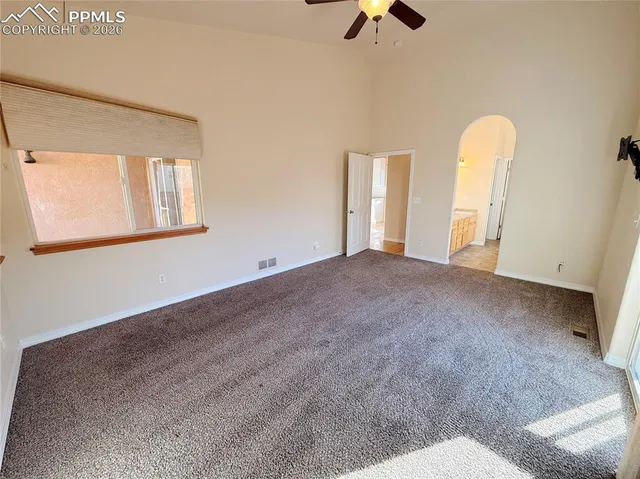 a en suite bathroom with a sink a mirror and a shower