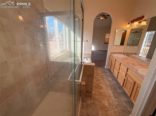 a view of a balcony with two chairs