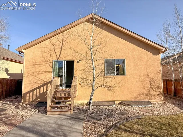 a view of a house with a street