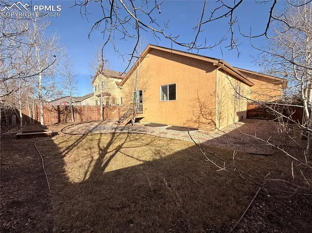 a view of a backyard with sitting area