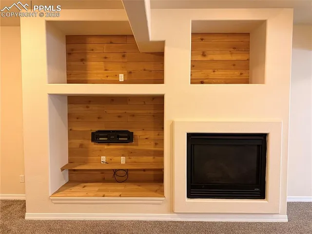 a living room with furniture and window