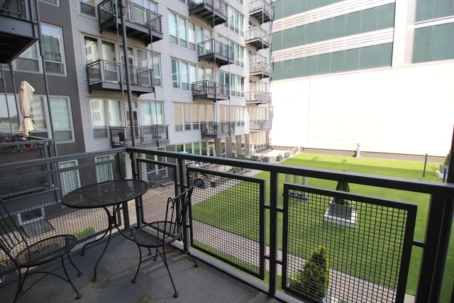 a view of a balcony with chairs